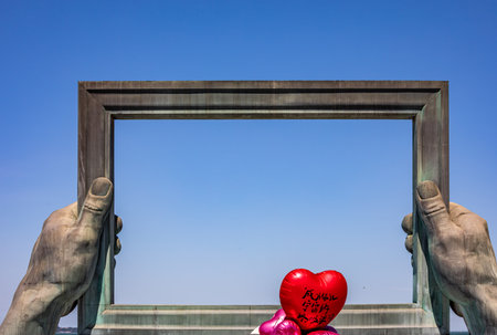 Valentine's day with heart shaped balloon in a frame.の写真素材