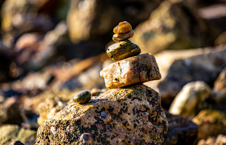 Stones stacked on top of each other on the seashoreの写真素材