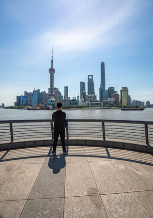 Unidentified man looking at Shanghai skyline. Shanghai is the capital and most popular city of China.の写真素材