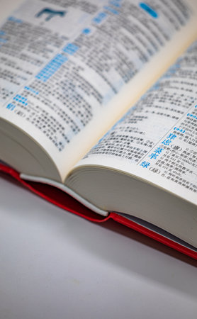 open book on white background, close-up, shallow depth of fieldの写真素材