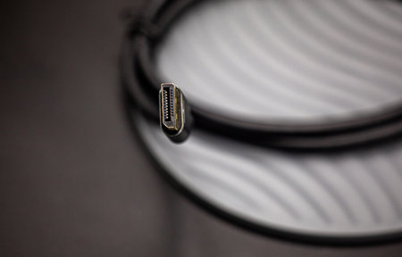 Close up view of a cable on a black background. Shallow depth of field.