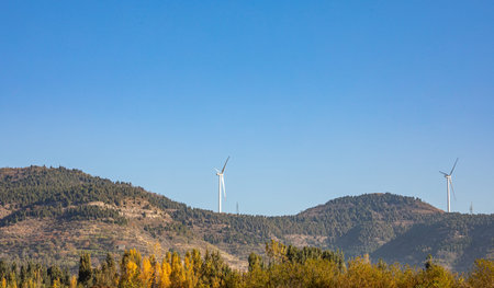 Wind turbines in the mountains. Windmill for electric power production.