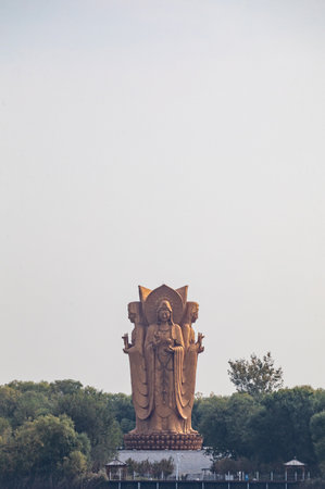 Statue of Buddha on the top of the mountain in the parkの写真素材