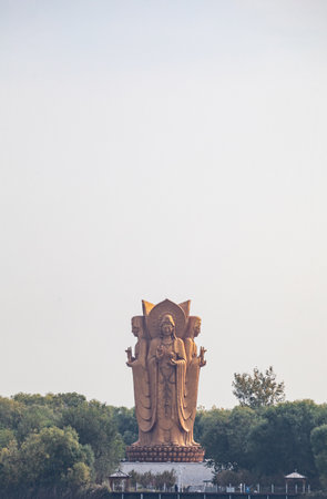 Statue of Guan Yin in the park, closeup of photoの写真素材