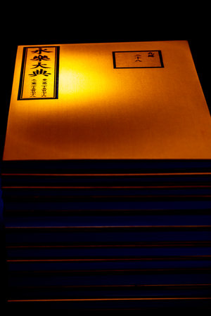 Illuminated paper box on black background, closeup of photoの写真素材