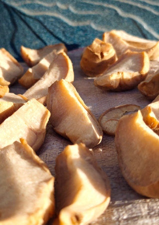 Dried mushrooms on a wooden table. Selective focus. Shallow depth of field.