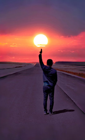 Man standing on the edge of the road and pointing his finger to the sunの写真素材