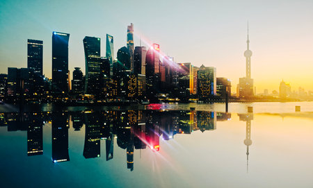 Shanghai skyline at sunset with reflection in Huangpu river,China.の写真素材