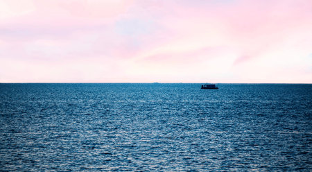Fishing boat on the sea at sunset. Selective focus.