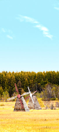 old windmill in the field, photo as a background, digital imageの写真素材