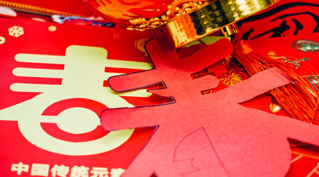 chinese new year decoration on red background, closeup of photoの写真素材