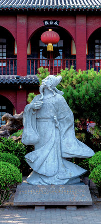 Sculpture of a woman in front of the temple.のeditorial素材