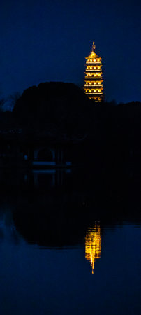 Pagoda at night in Hangzhou, China. The pagoda is a symbol of the city.の写真素材