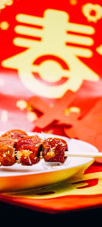Chinese New Year food on a plate with a red background.