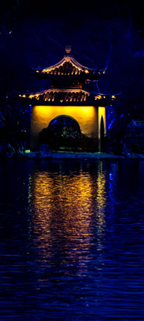 Night view of a Chinese pavilion in a lake, Beijing, Chinaの写真素材
