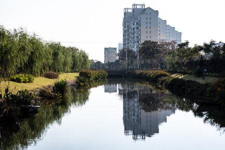 Urban landscape with a river and a modern building in the background.