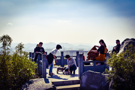 Tourists at the top of the mountainの写真素材