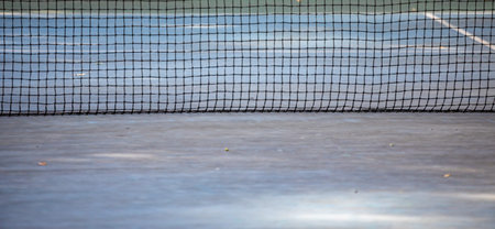 Tennis net on the tennis court. Selective focus and shallow depth of field.
