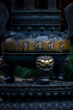 Ancient Chinese bronze incense burner in a temple, closeup of photoの写真素材