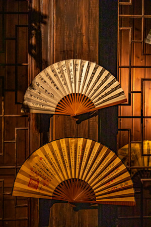 Folding fan hanging on the wall of a Japanese temple in Kyotoの写真素材