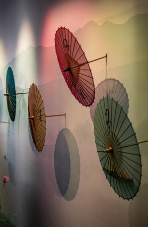 Colorful paper umbrellas on a wall in a Chinese templeのeditorial素材