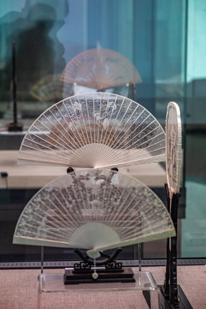 Close-up of a fan in a shop window of a storeの写真素材
