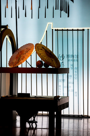 Pianist's chair and umbrella in the music hall, Thailand.の写真素材