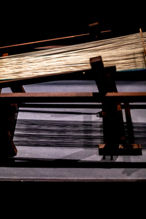 Weaving loom in a dark room, closeup of photoの写真素材