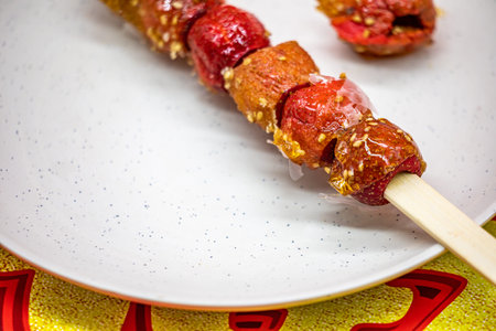 skewers with dried tomatoes and sesame on a plate