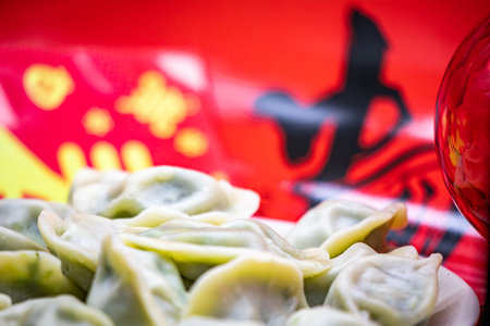Chinese dumplings on a red background, closeup of photoの写真素材