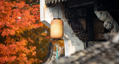 Lantern hanging on the wall of a Chinese house in autumn