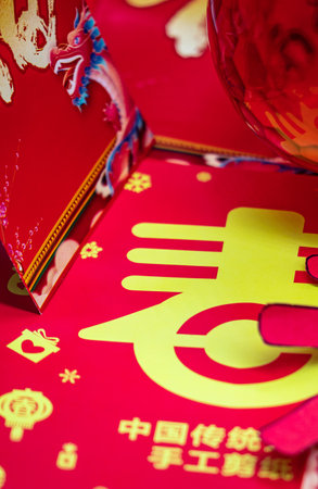 Chinese New Year decoration, closeup of red envelope and gold ingotsの写真素材