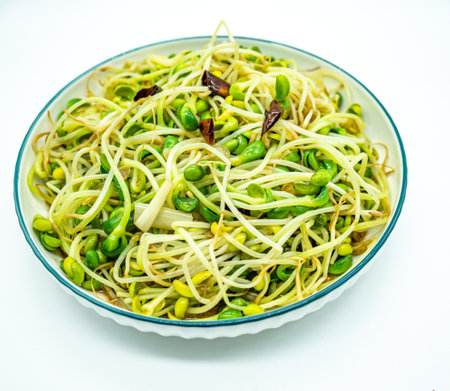 Green soybean sprouts with bean sprouts on white background.の写真素材