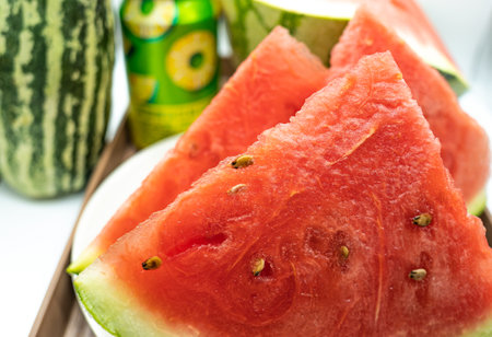 Watermelon slices on a wooden spoon. Selective focus. nature.の写真素材