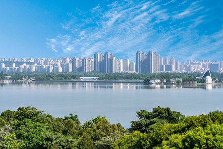 Scenery of a lake and buildings in Shenzhen,China.の写真素材