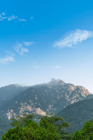 Mountain landscape with blue sky and white clouds at hong kongの写真素材