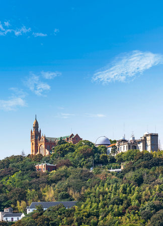 View of the Church of St. Mary of the Assumption from the hill in Edinburgh, Scotlandの写真素材