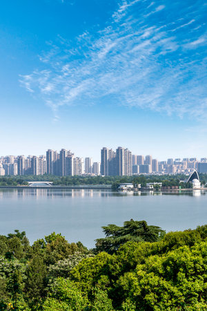 Beautiful landscape of Hangzhou West Lake and city skyline under blue skyの写真素材