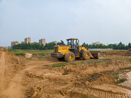 Yellow bulldozer on the road construction site. Landscape design.の写真素材