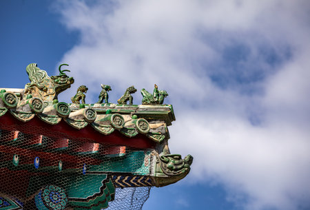 Chinese temple roof with blue sky and clouds, closeup of photoの写真素材