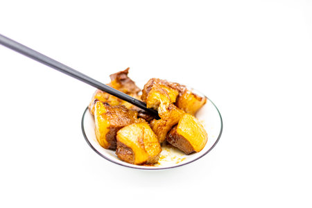 Fried potatoes in a bowl on a white background, isolate.の写真素材