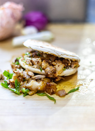 Turkish Doner Kebab with Pita bread on the wooden tableの写真素材