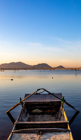 Fisherman boat on the Mekong River in Vietnam at sunsetの写真素材