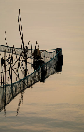 Fishing nets in the sea at sunset,Thailand,Asiaの写真素材
