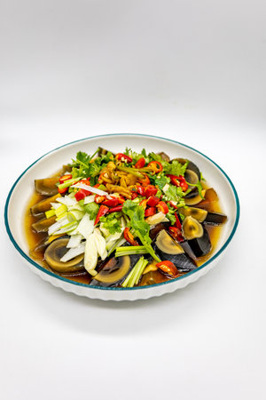 Thai spicy salad with salted eggplants on white backgroundの写真素材