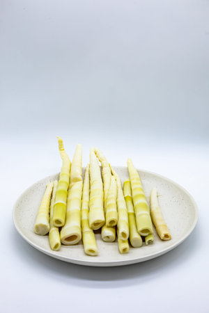 Crispy bamboo shoot on white dish isolated on white background.