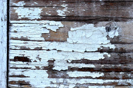 White oil paint peeling off the woodの写真素材