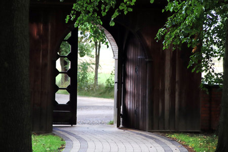 Alley in the park next to the church in Bardzice. st. Andrzej Bobola