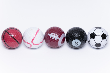 Golfball painted like a ball of many different kinds of sportsの写真素材