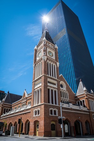 Perth Town Hall in Western Australia old brick building in front of modern skyscrapersの写真素材
